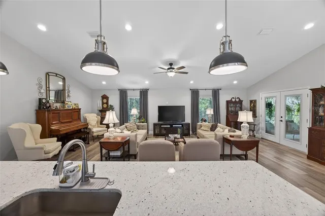 a living room with furniture fireplace and a flat screen tv