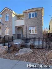 a brick house with a small yard and a large window