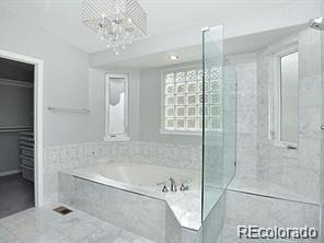 244 South Monroe Street Denver, CO 80209 - Photo 9 of 16 a bathroom with a bathtub and shower