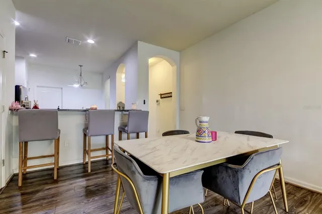 a kitchen with a table and chairs in it