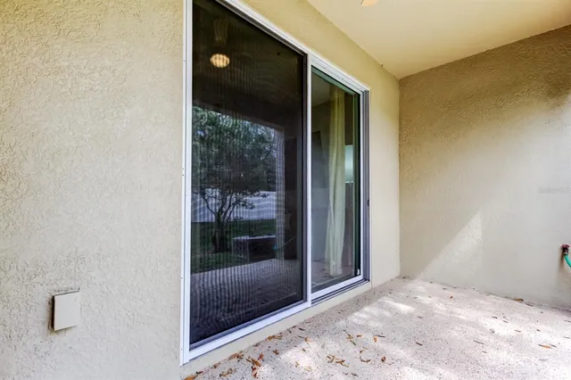 a view of a big room with sliding door and wooden floor