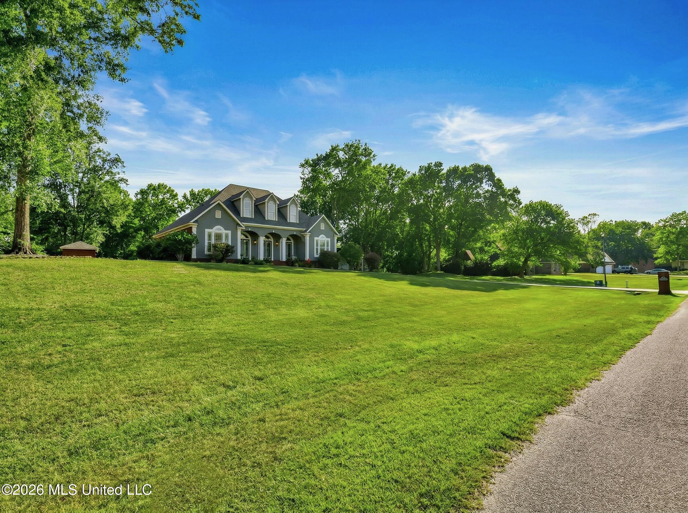 5402 Huckleberry Lane Moss Point, MS 39562 - Photo 63 of 63 make_front_yard_and_trees_gree_Nano_Bana