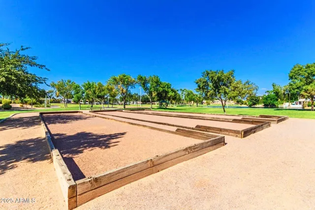 a view of a grassy field with trees