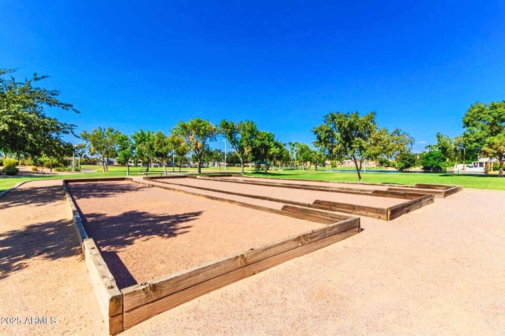 1115 South Tiago Drive Gilbert, AZ 85233 - Photo 20 of 22 a view of a swimming pool with a yard