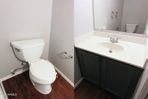 a white toilet sitting next to a bathroom sink