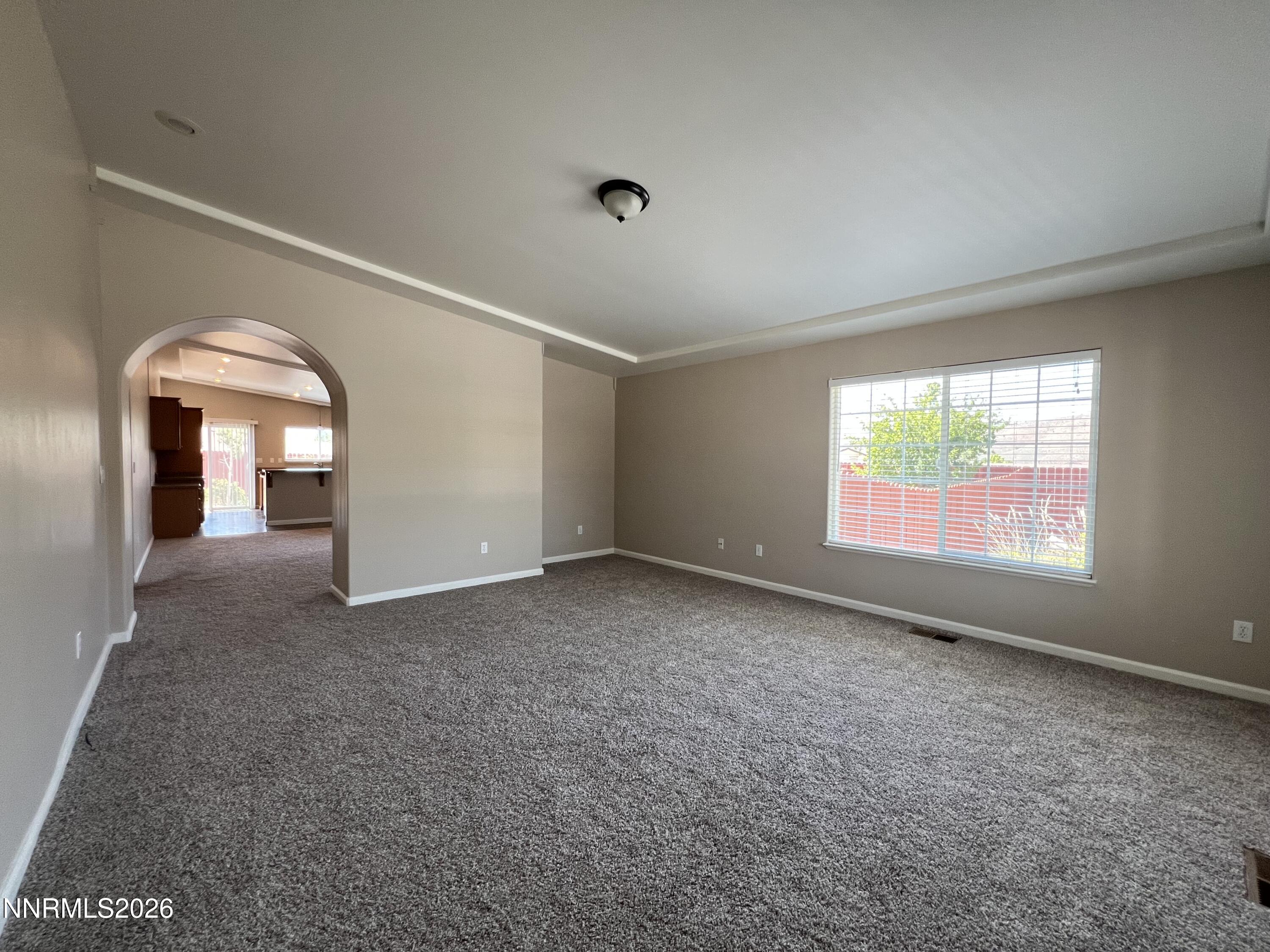 18406 Teddy Bear Court Reno, NV 89508 - Photo 3 of 44 an empty room with windows