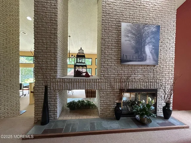 a living room with furniture and a lamp