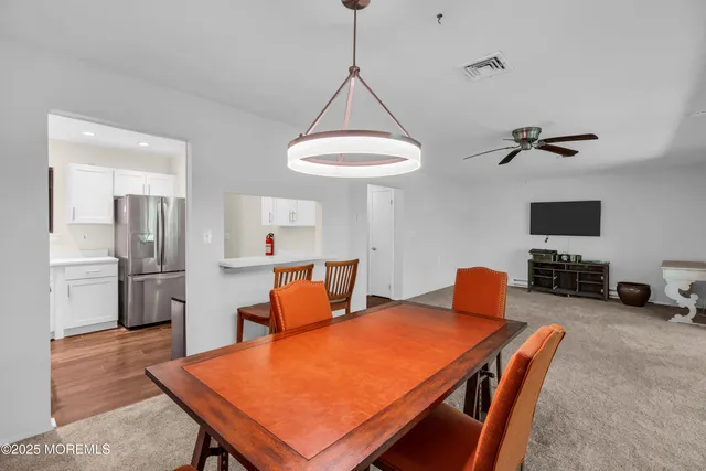 a kitchen with stainless steel appliances a refrigerator sink and stove