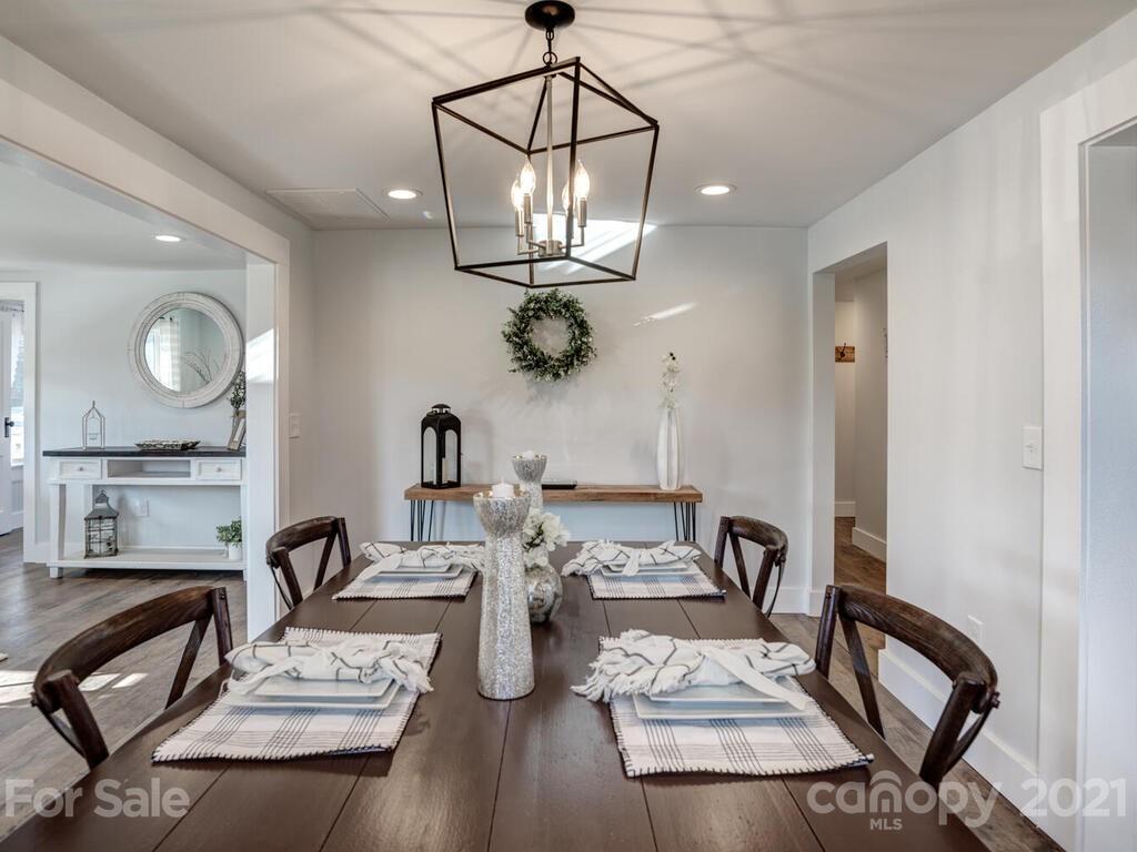36 Center Pigeon Road Canton, NC 28716 - Photo 13 of 30 a view of a dining room with furniture and wooden floor