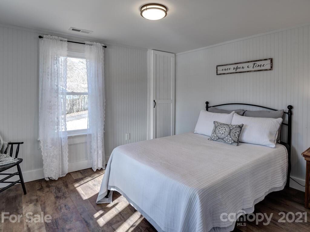 36 Center Pigeon Road Canton, NC 28716 - Photo 20 of 30 a bedroom with a bed and a window