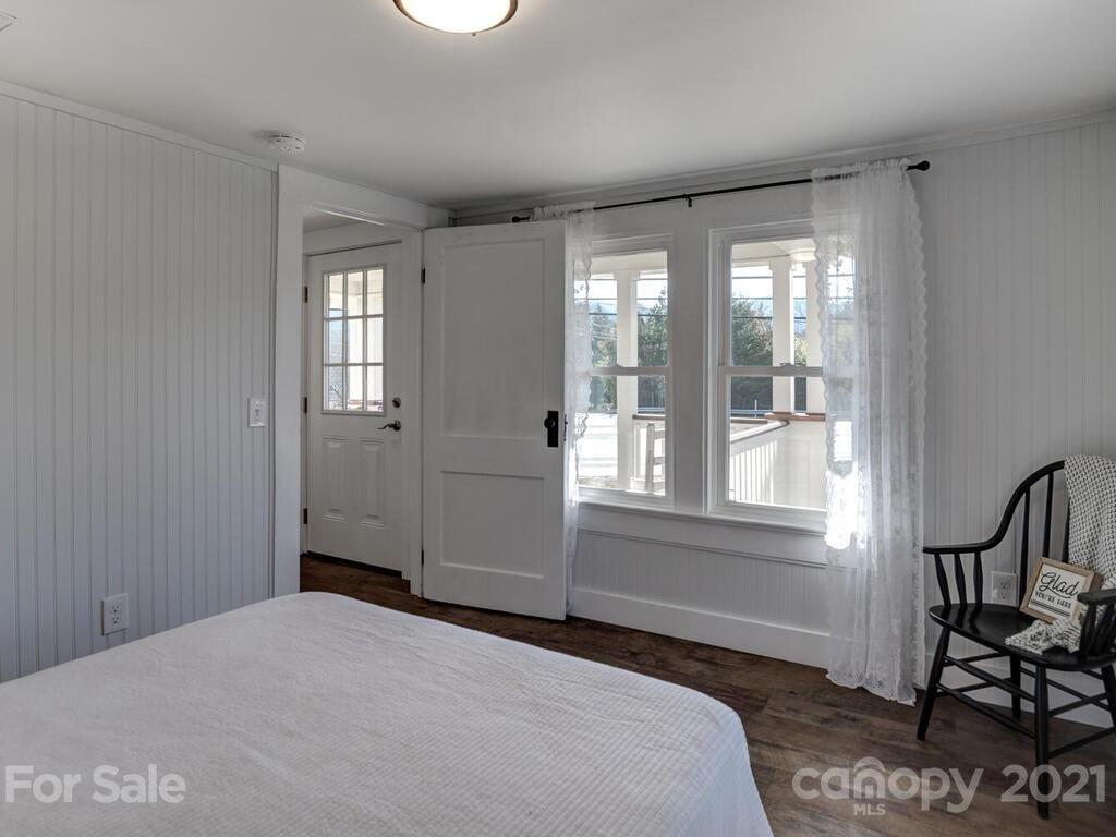 36 Center Pigeon Road Canton, NC 28716 - Photo 21 of 30 a bedroom with a bed and a window