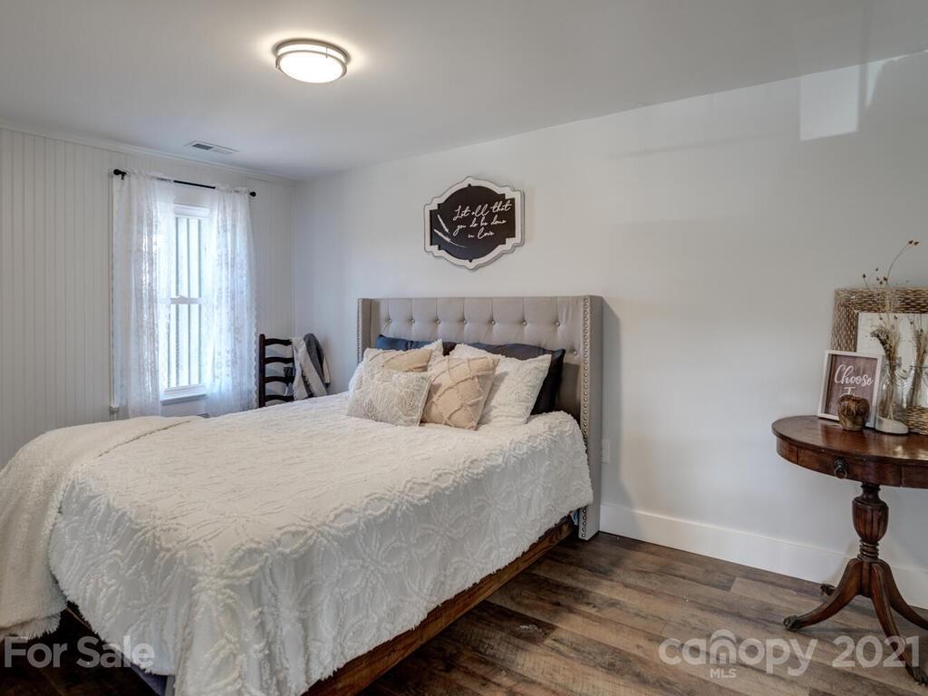 36 Center Pigeon Road Canton, NC 28716 - Photo 22 of 30 a bedroom with a bed and a window