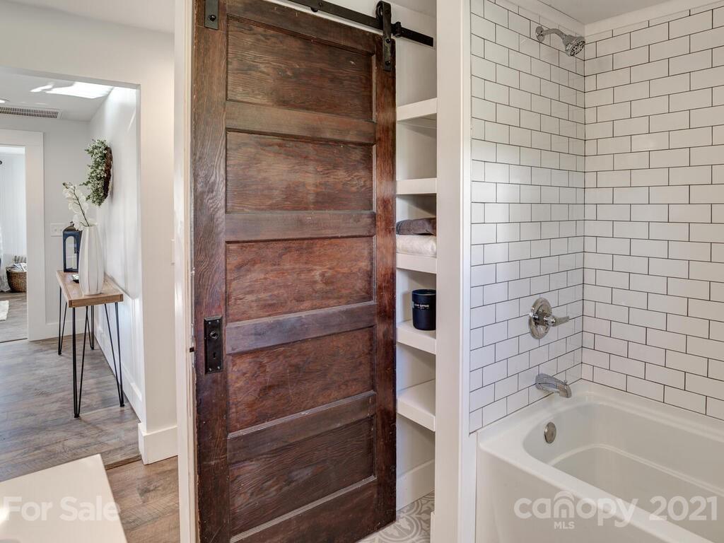 36 Center Pigeon Road Canton, NC 28716 - Photo 25 of 30 a bathroom with a tub