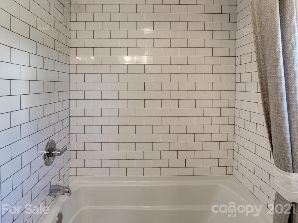 36 Center Pigeon Road Canton, NC 28716 - Photo 26 of 30 a bathroom with a bathtub