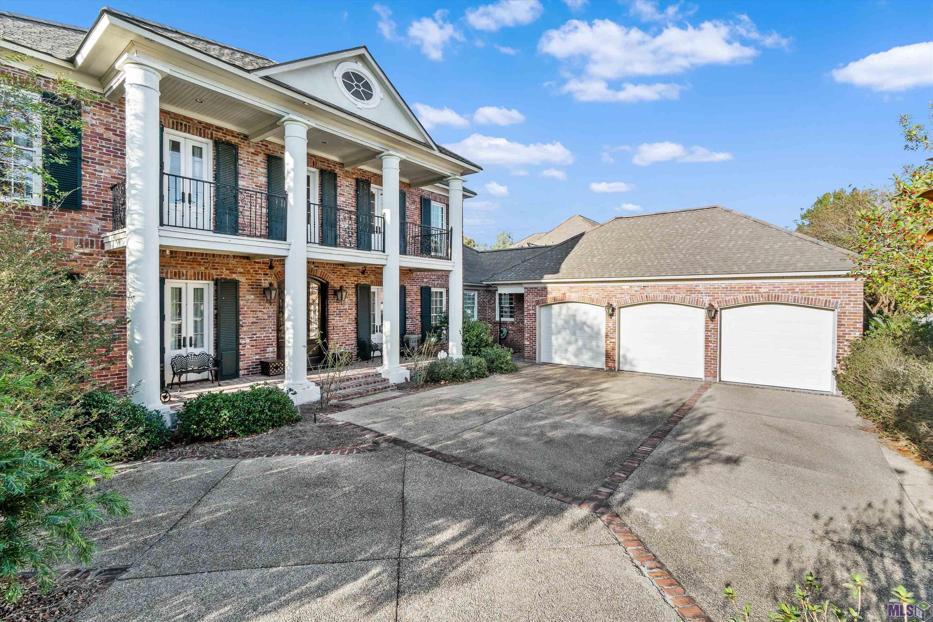 3 CAR GARAGE PLUS  DRIVE WAY PARKING