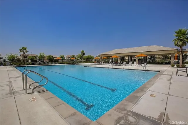 a view of a swimming pool with chairs