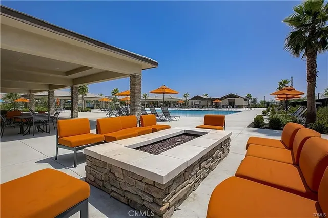 a outdoor space with patio couches and a potted plant