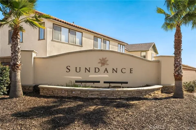 a sign that is sitting in front of a house