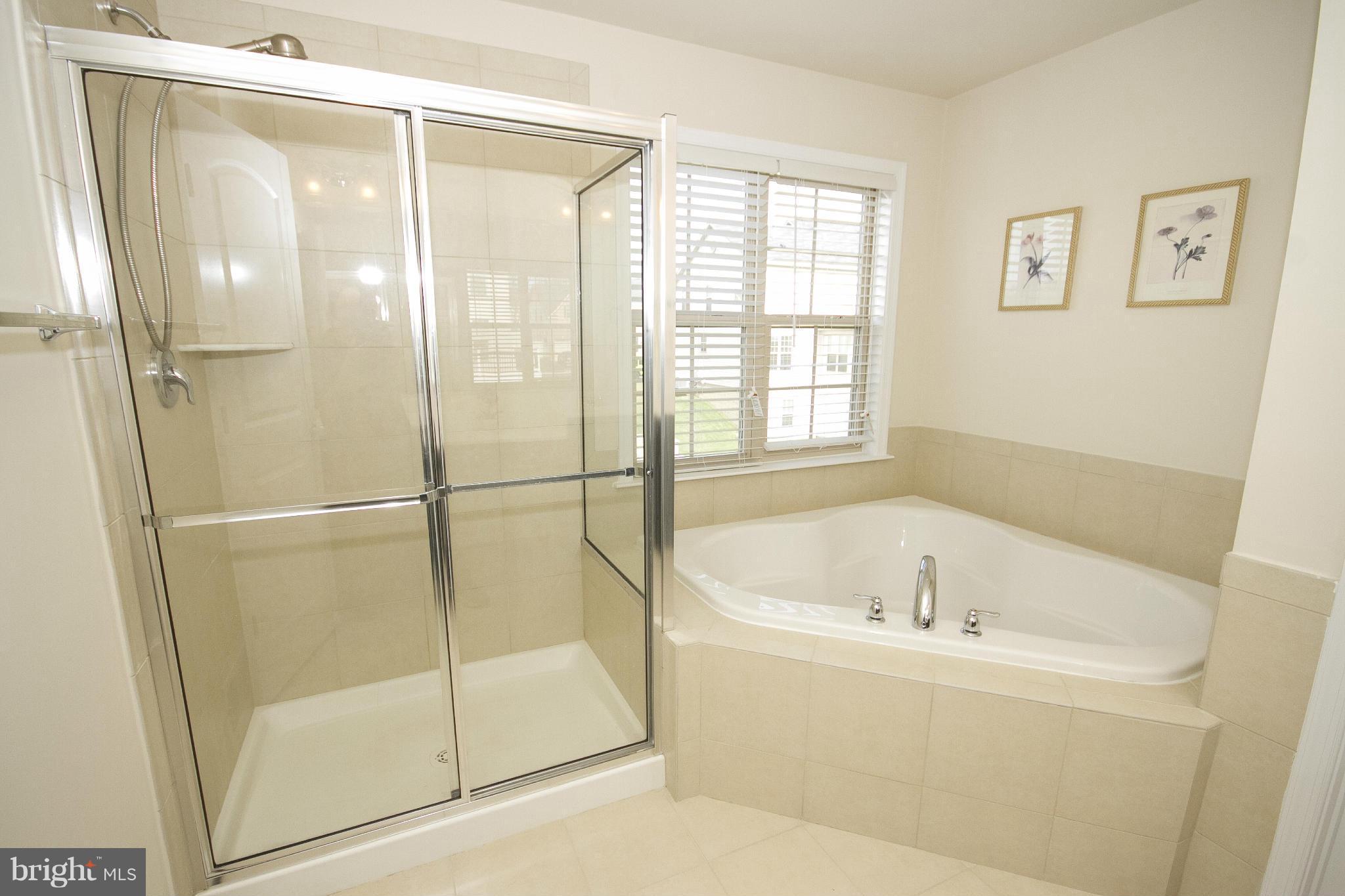 4310 Stoss Road Perry Hall, MD 21128 - Photo 14 of 22 a bathroom with a bathtub and a shower