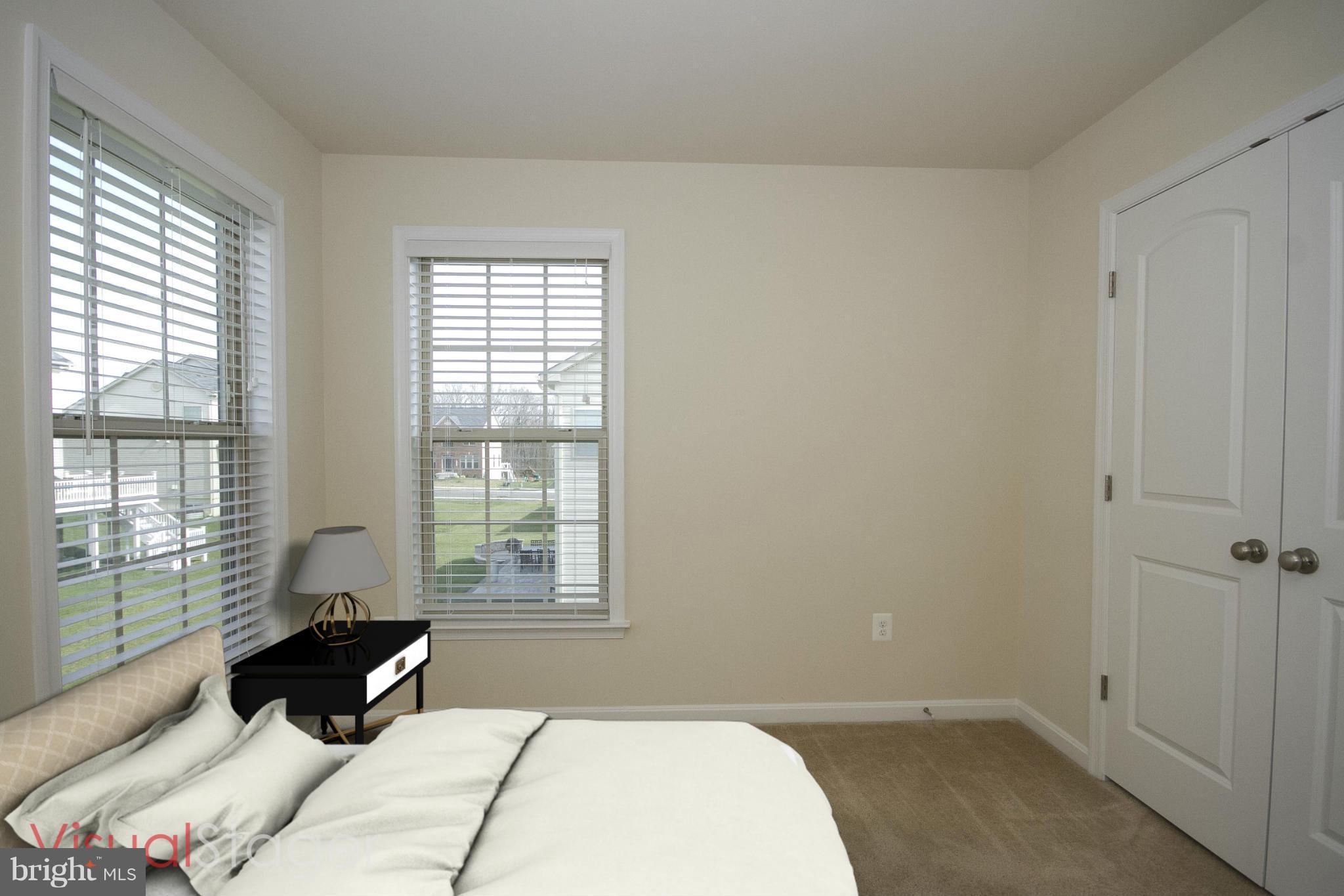 4310 Stoss Road Perry Hall, MD 21128 - Photo 16 of 22 a bedroom with a bed and wooden floor