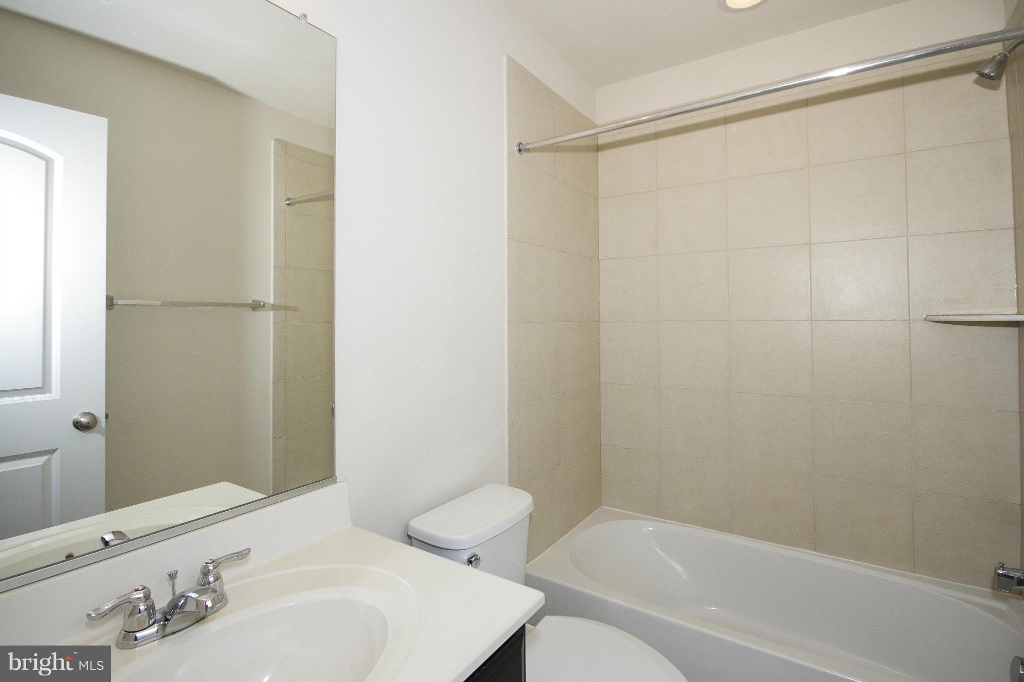 4310 Stoss Road Perry Hall, MD 21128 - Photo 17 of 22 a bathroom with a sink and a bathtub