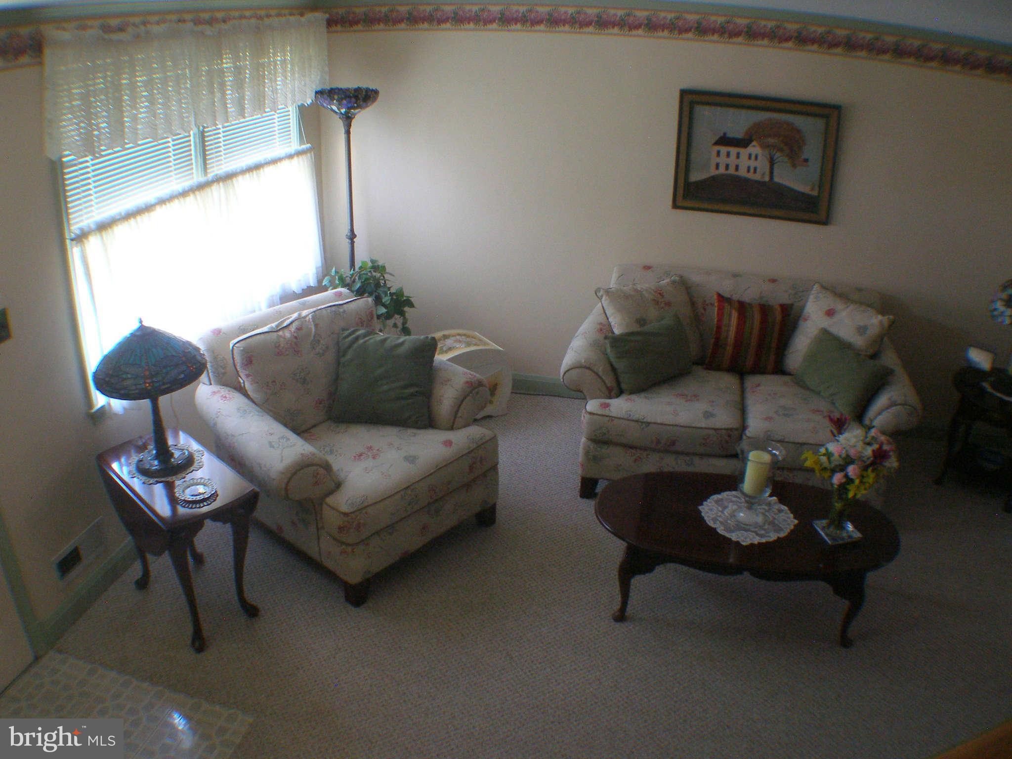 1516 Barrett Road Baltimore, MD 21207 - Photo 2 of 25 a living room with furniture and a window