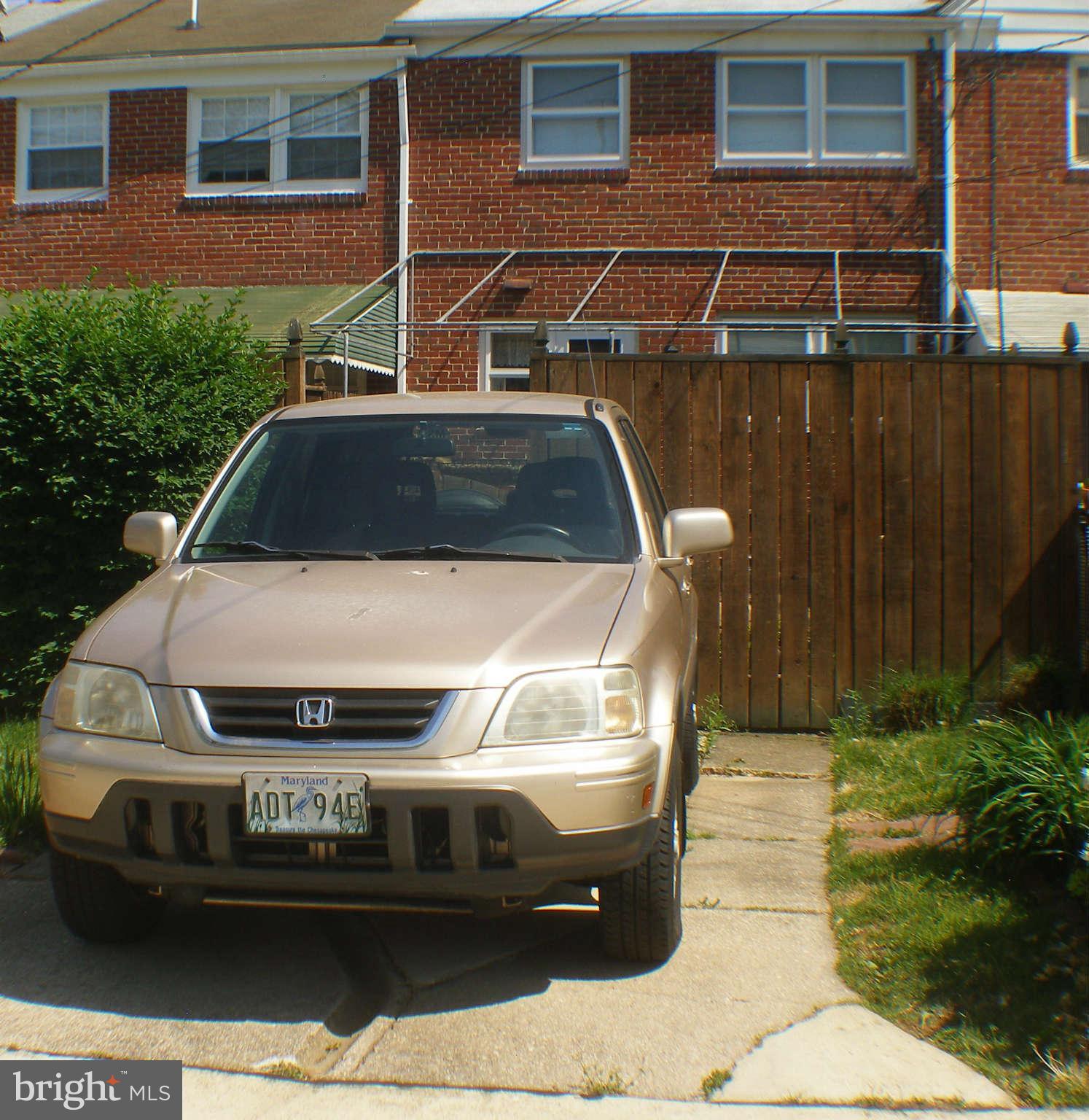 1516 Barrett Road Baltimore, MD 21207 - Photo 24 of 25 a car parked in front of a building