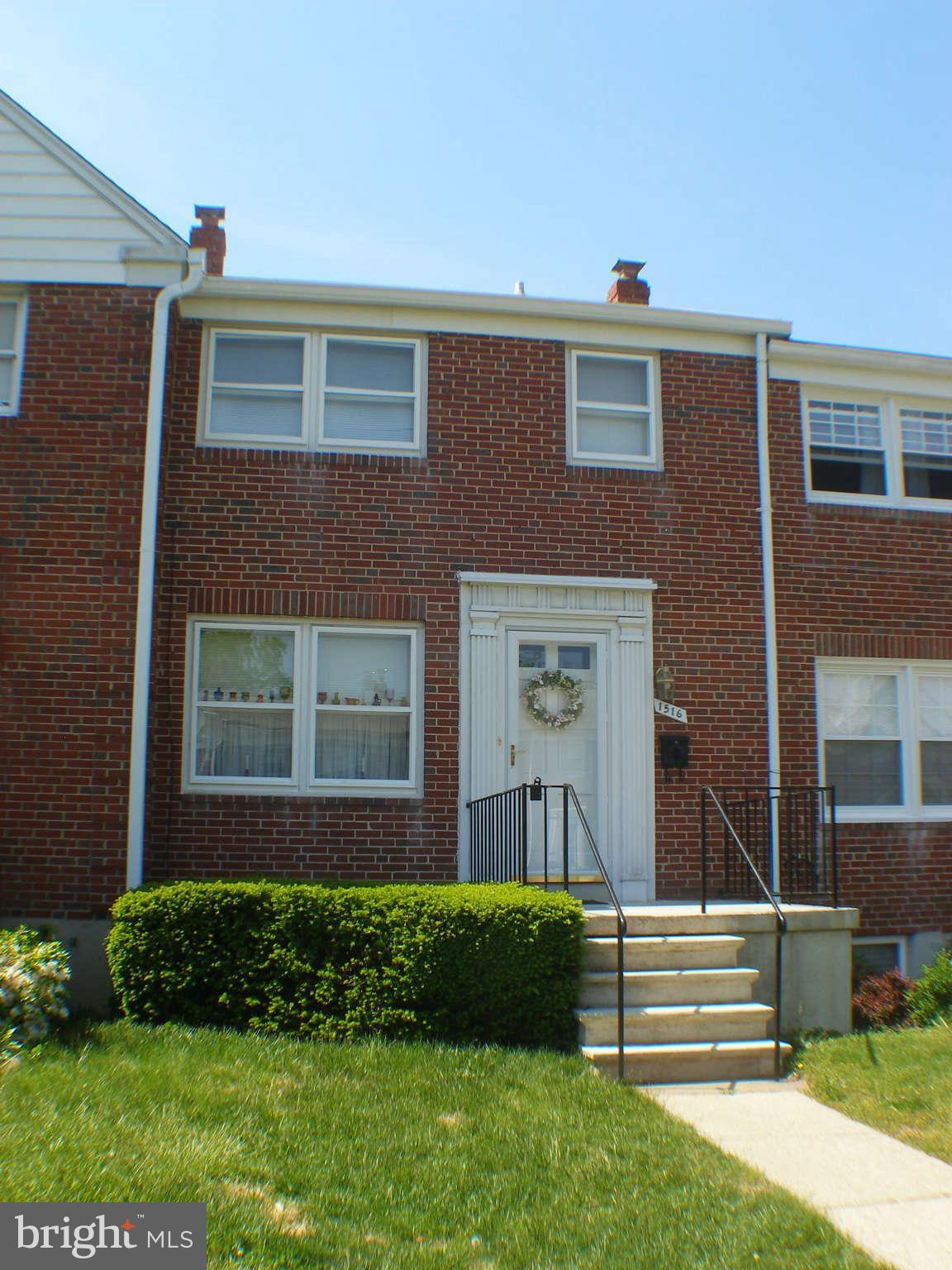 1516 Barrett Road Baltimore, MD 21207 - Photo 25 of 25 a front view of a house with a yard