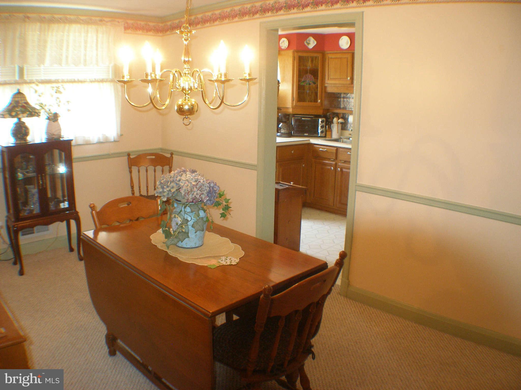 1516 Barrett Road Baltimore, MD 21207 - Photo 6 of 25 a dining room with furniture and window