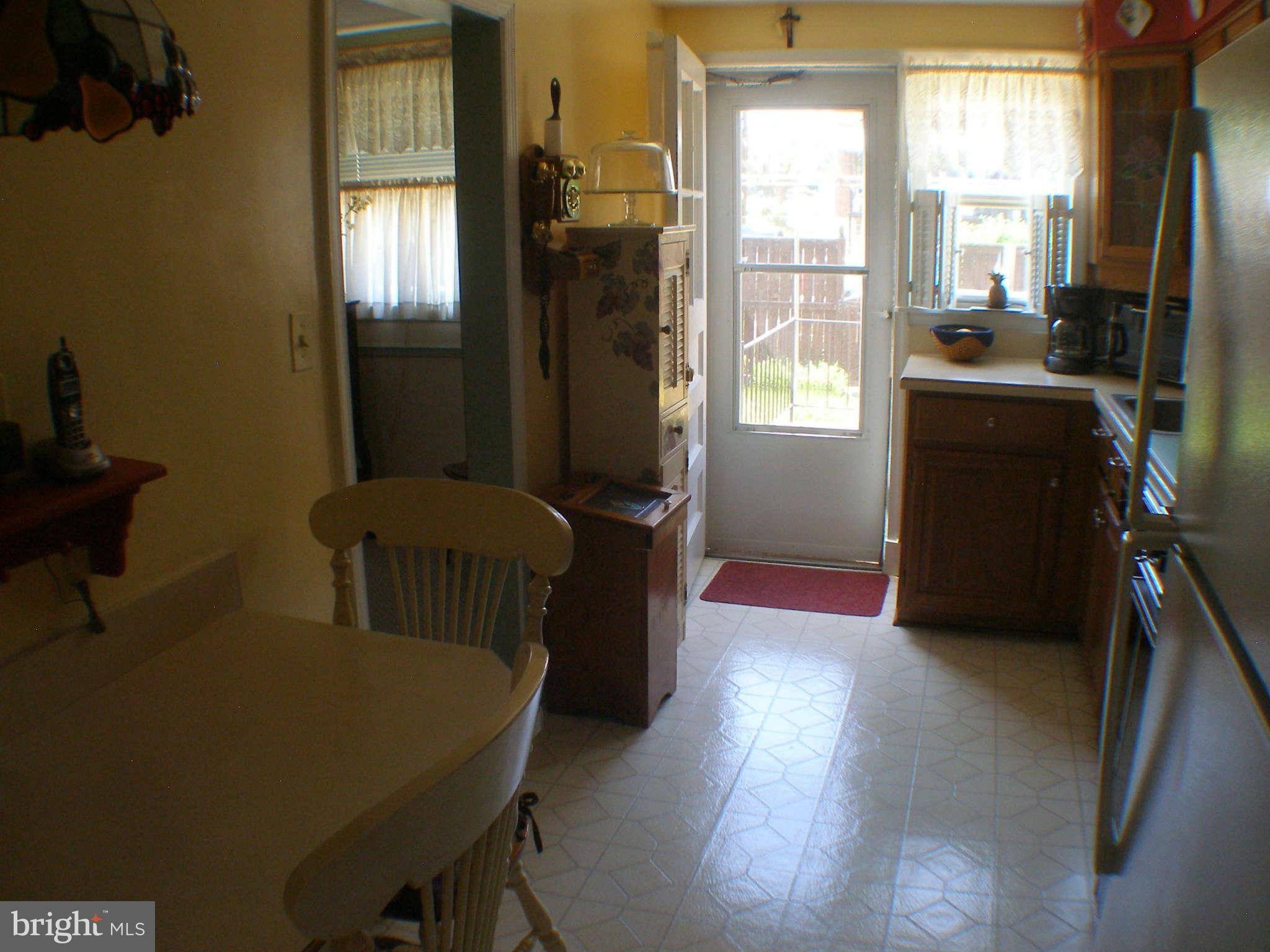 1516 Barrett Road Baltimore, MD 21207 - Photo 8 of 25 a bedroom with furniture and a window