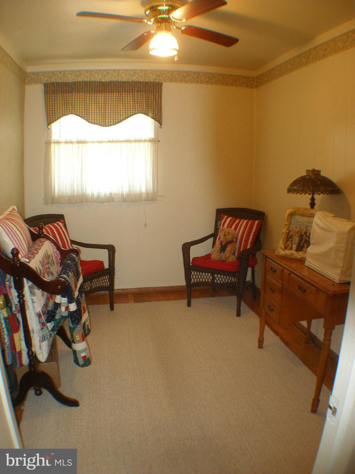 1516 Barrett Road Baltimore, MD 21207 - Photo 9 of 25 a living room with furniture and a window