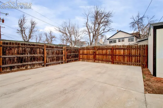 a view of wooden fence and a snow