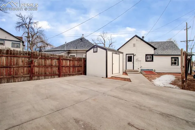 a view of a backyard of a house