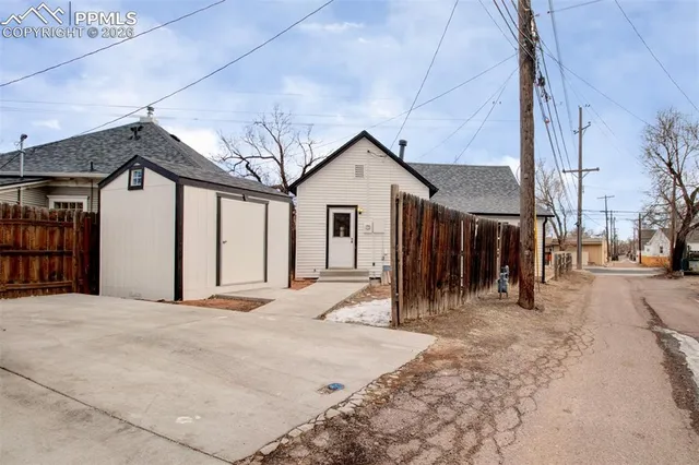 a view of a house with a snow in a yard