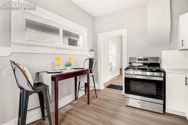 a kitchen with stainless steel appliances a stove a microwave and a refrigerator