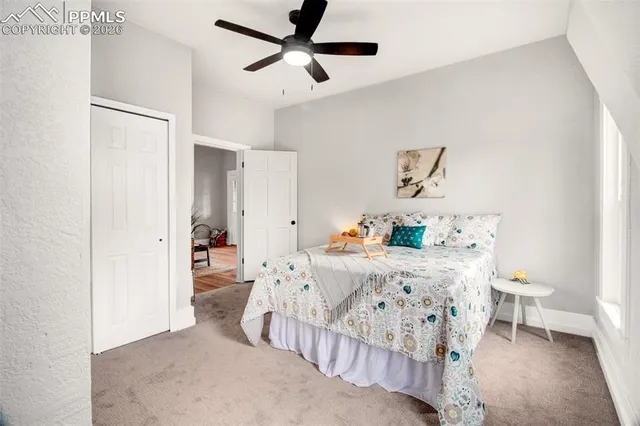 a bedroom with furniture and a window