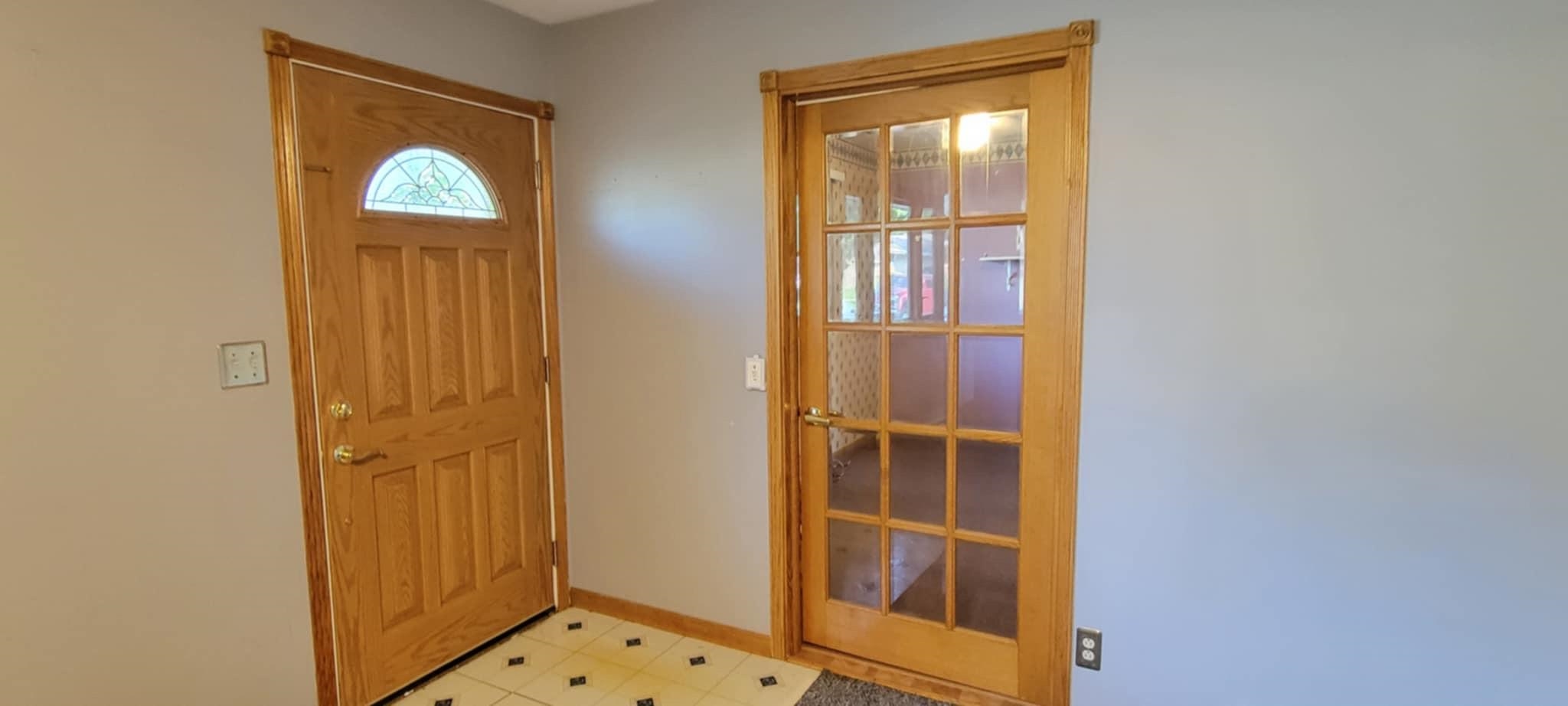451 Rebecca Road Belvidere, IL 61008 - Photo 8 of 30 a view of front door with wooden door