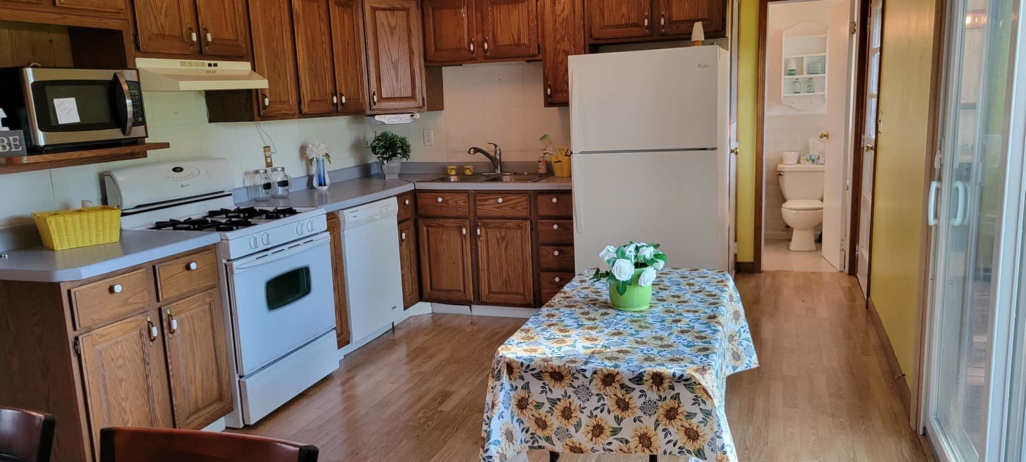 451 Rebecca Road Belvidere, IL 61008 - Photo 9 of 30 a kitchen with stainless steel appliances granite countertop a refrigerator a stove and a wooden floor