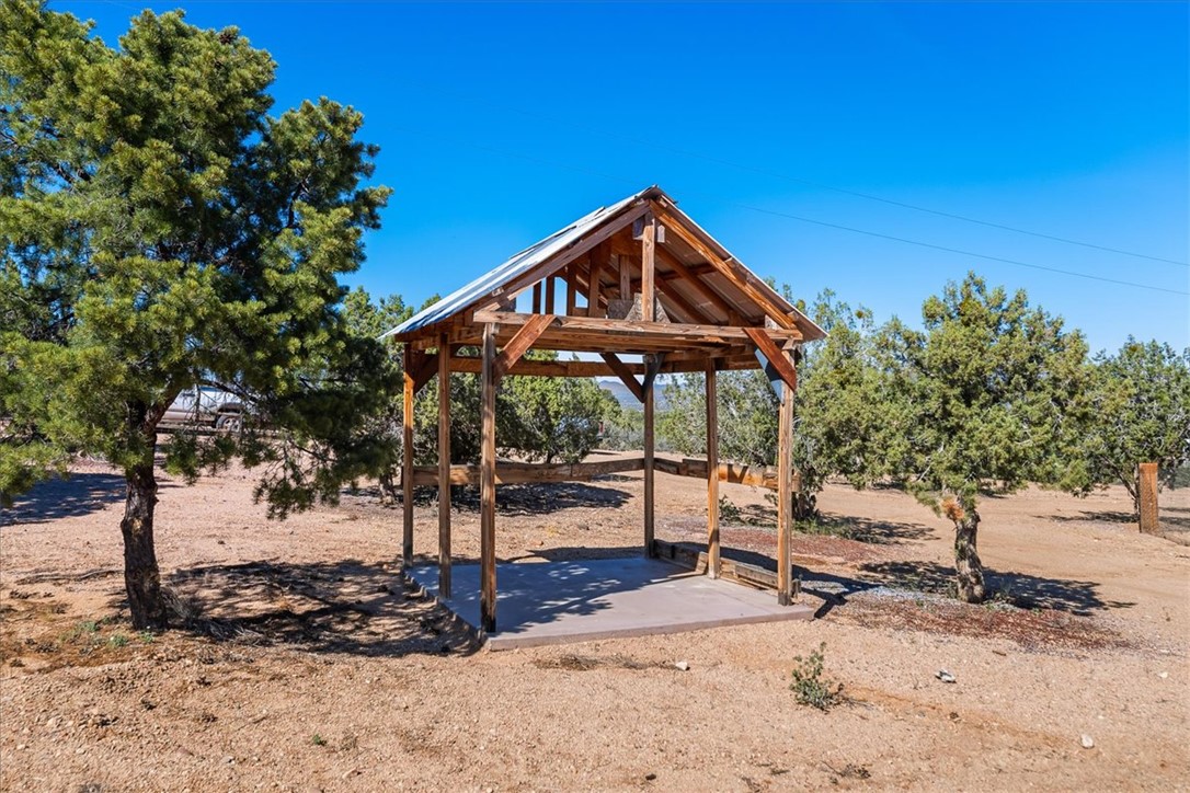 10374 East Happy Trails Road Kingman, AZ 86401 - Photo 51 of 68 a front view of a house with a yard