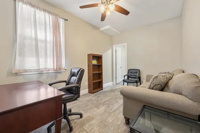 a living room with furniture and a window