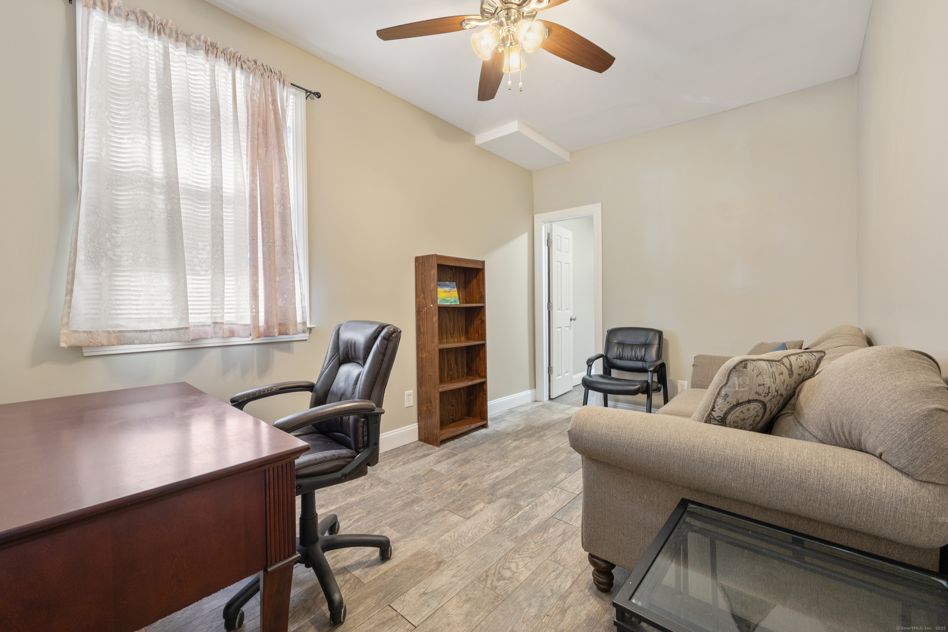 230 Frost Road Waterbury, CT 06705 - Photo 11 of 24 a living room with furniture and a window