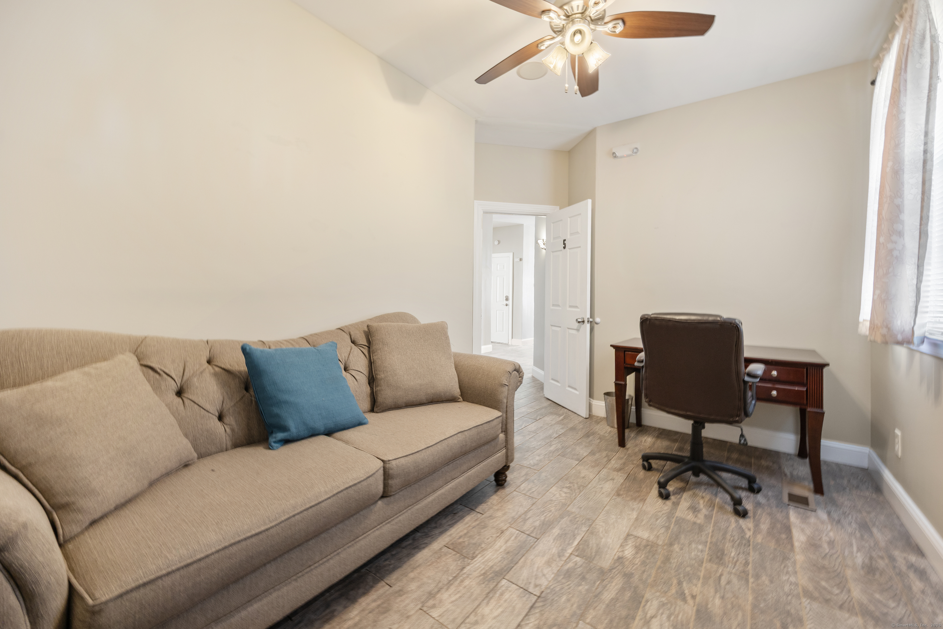 230 Frost Road Waterbury, CT 06705 - Photo 12 of 24 a living room with furniture and a rug