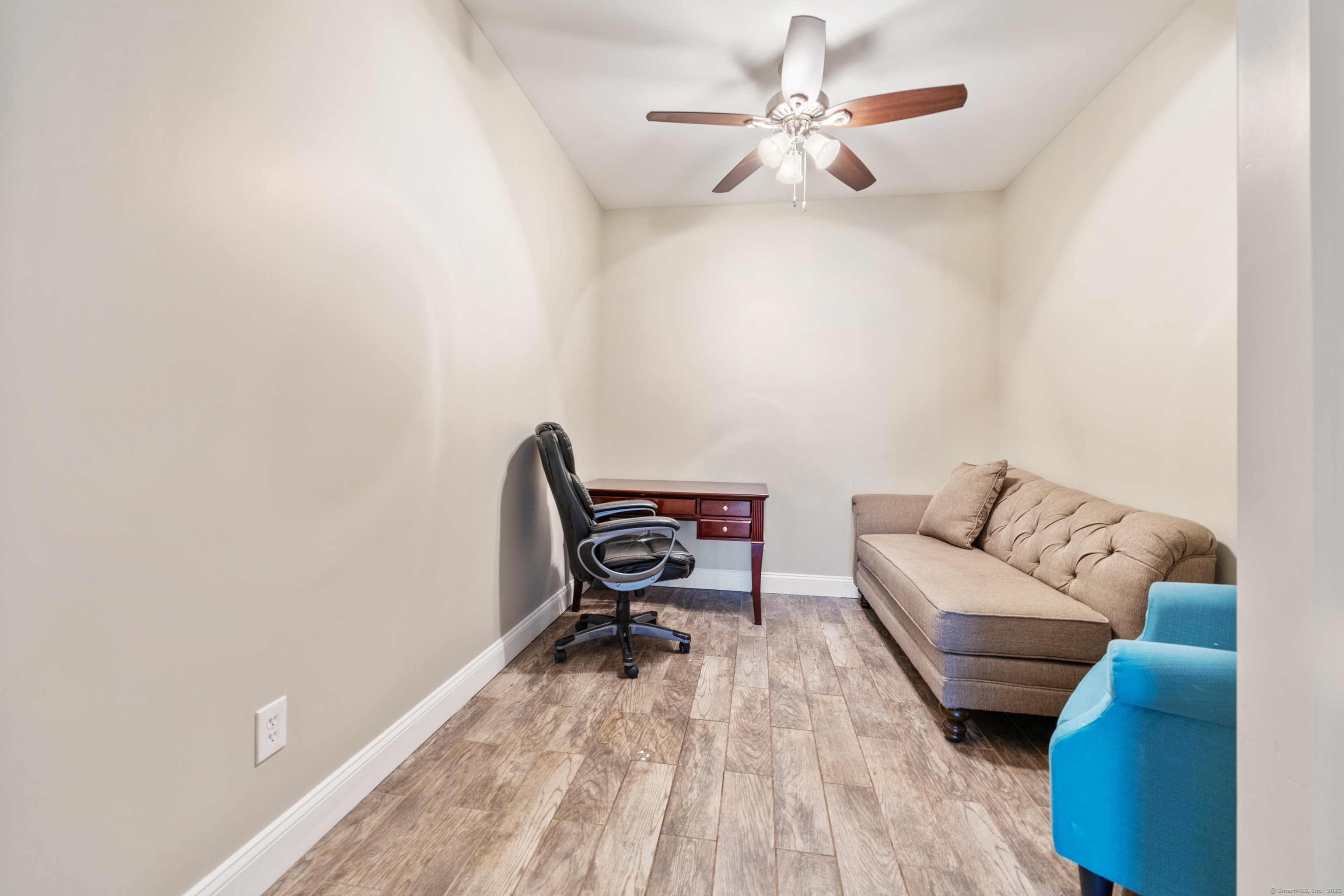 230 Frost Road Waterbury, CT 06705 - Photo 13 of 24 a living room with furniture and a wooden floor