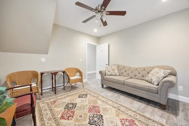 a living room with furniture and a rug