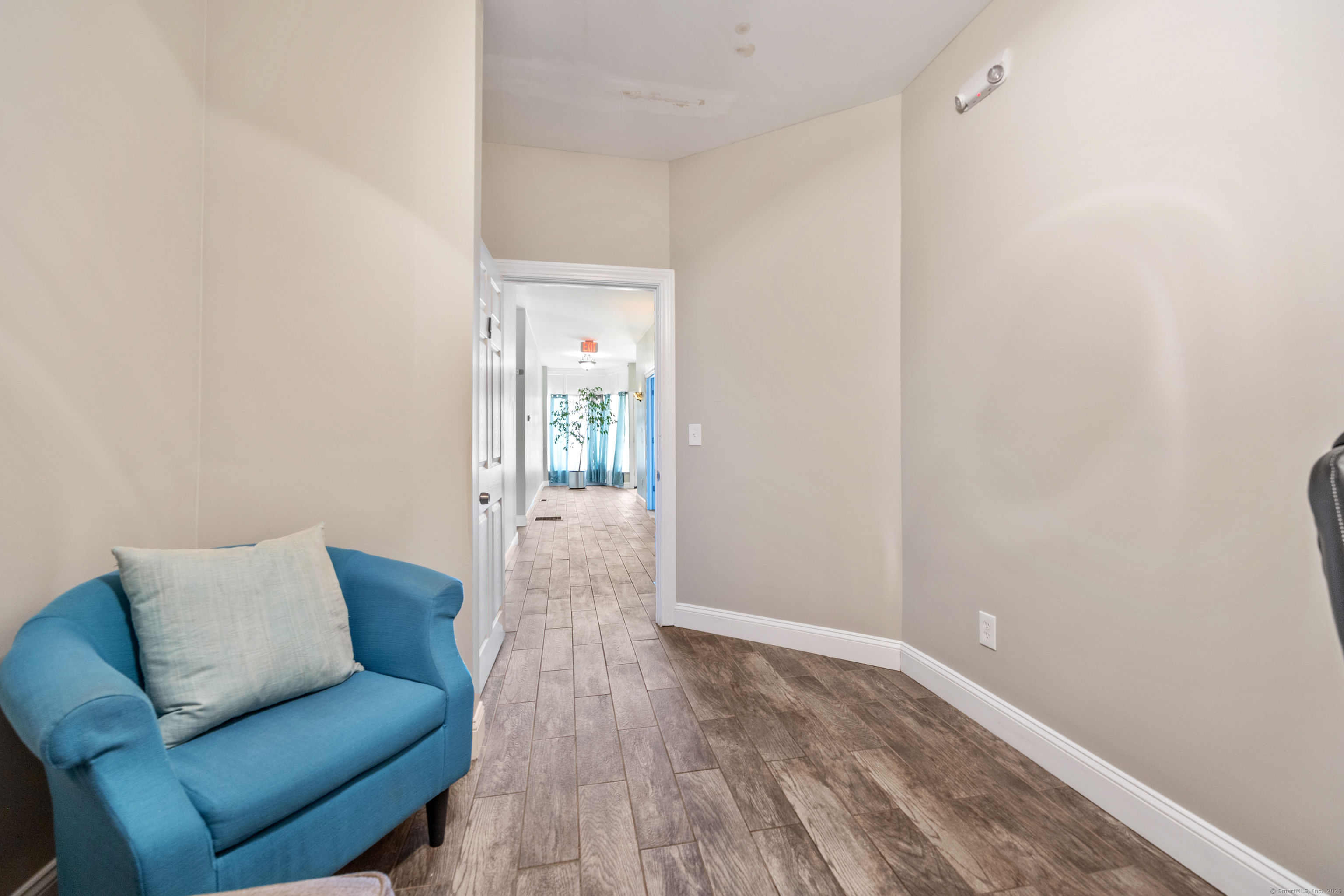 230 Frost Road Waterbury, CT 06705 - Photo 16 of 24 a living room with furniture and a wooden floor