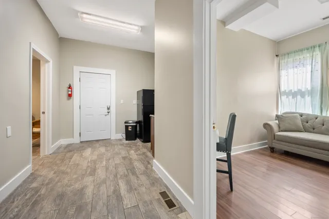 a view of a livingroom with a furniture and wooden floor