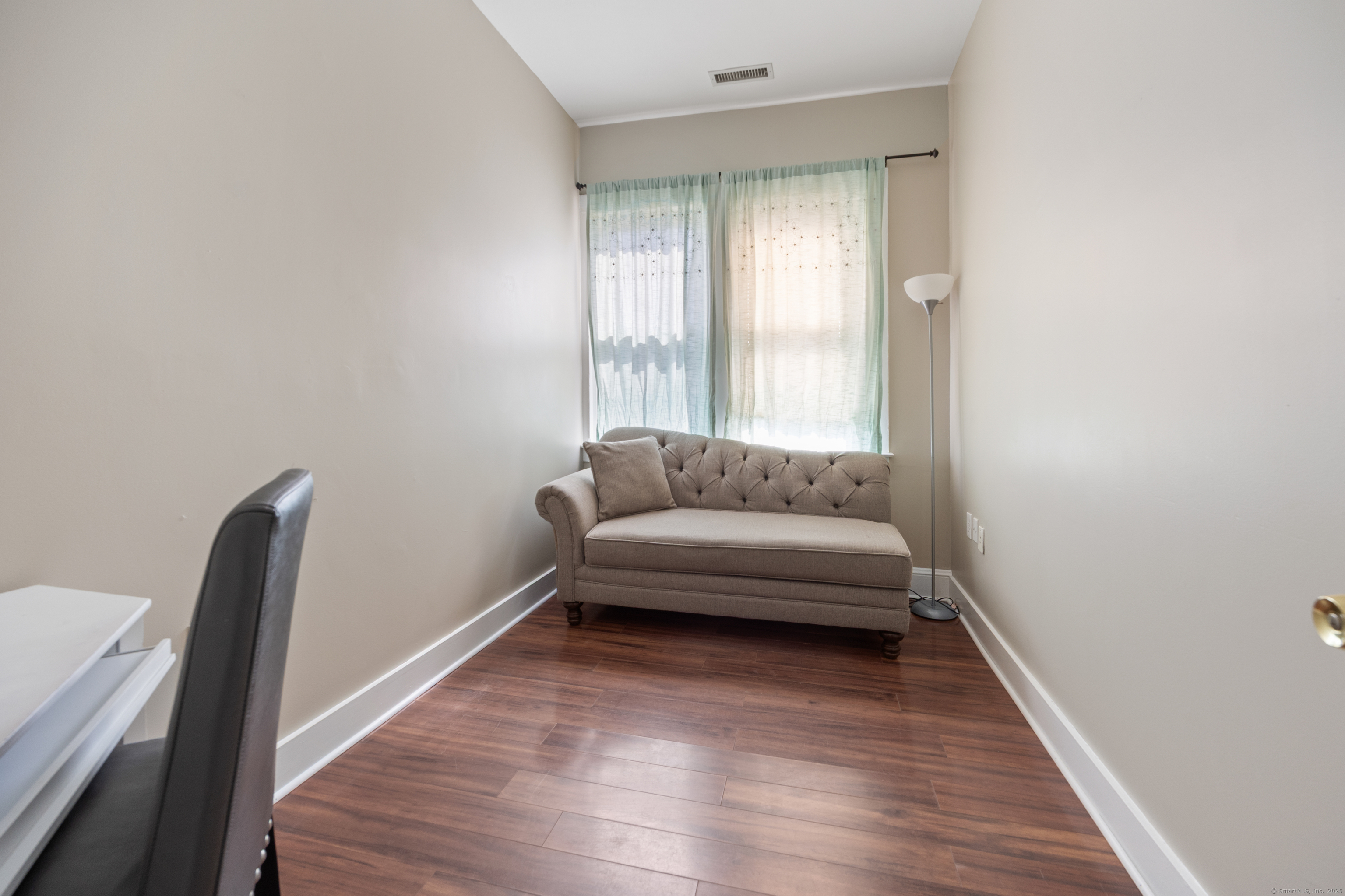 230 Frost Road Waterbury, CT 06705 - Photo 19 of 24 a living room with furniture and a wooden floor