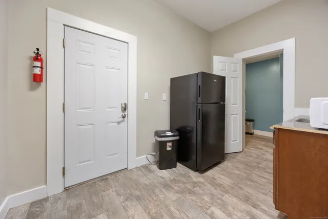 a kitchen with stainless steel appliances a refrigerator and a stove
