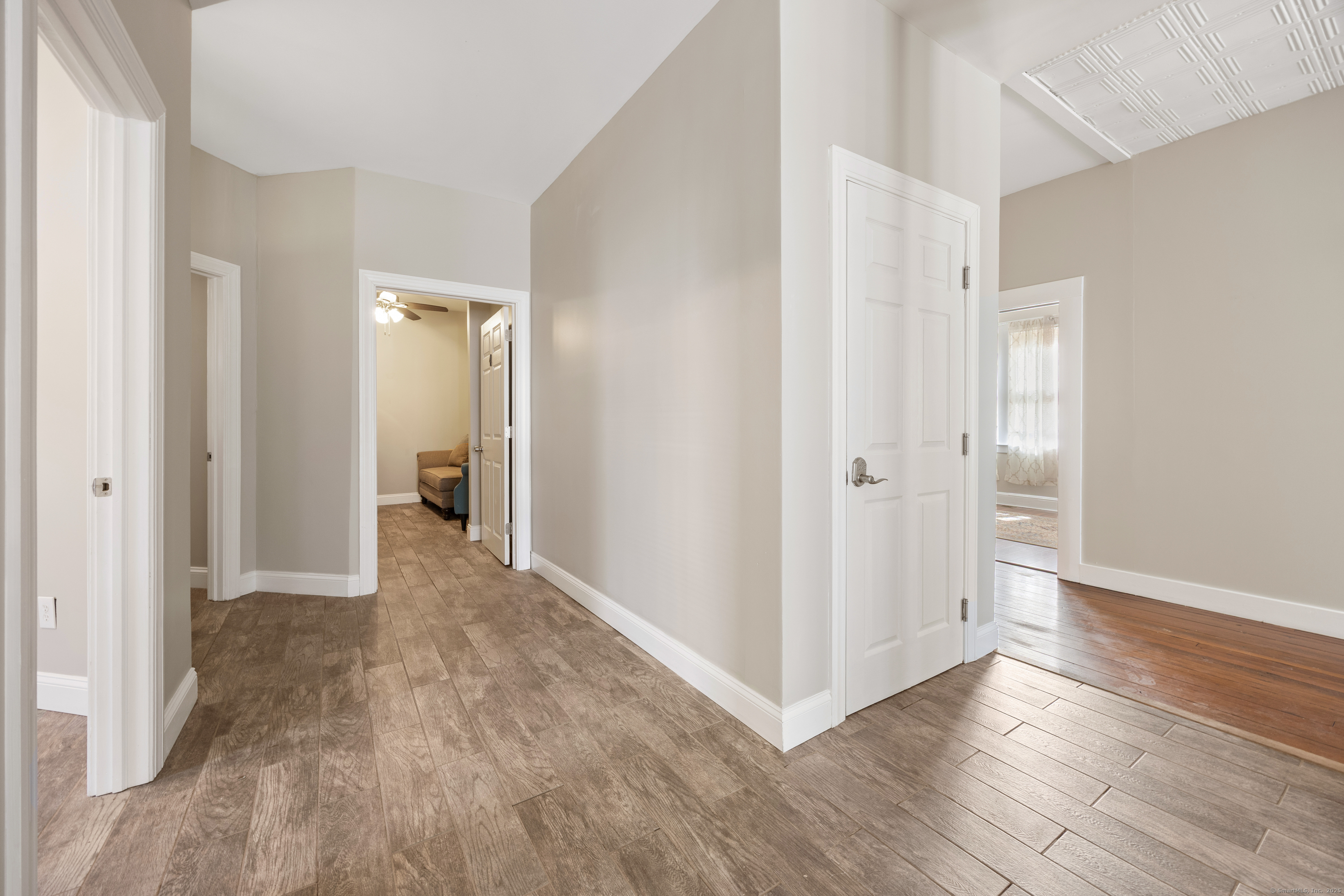230 Frost Road Waterbury, CT 06705 - Photo 8 of 24 a view of a hallway with wooden floor