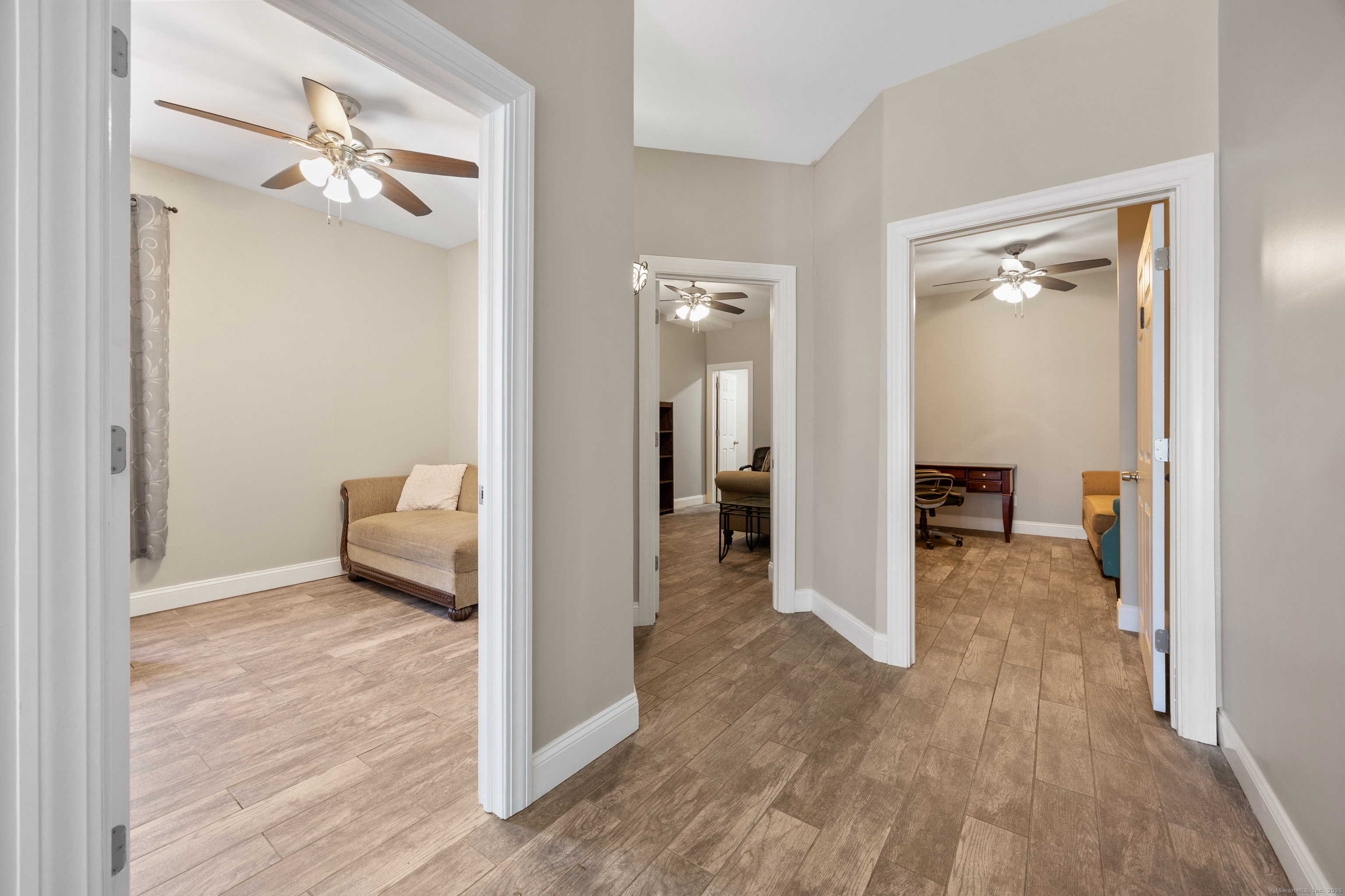 230 Frost Road Waterbury, CT 06705 - Photo 9 of 24 a view of a room with a hardwood floor and a bathroom